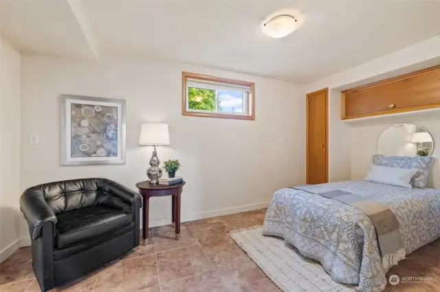 Lower-level bedroom with ensuite bath and radiant heated floors