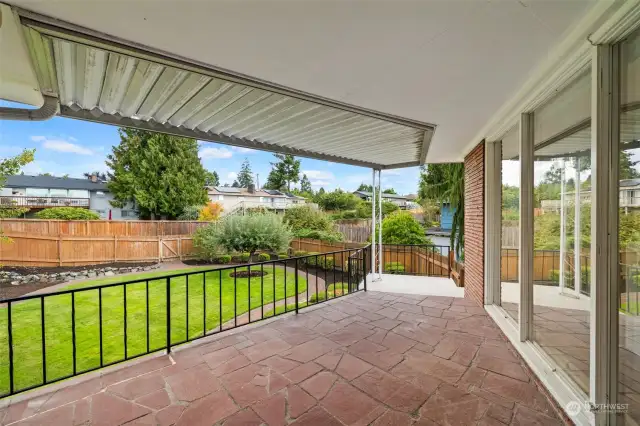 Stairs lead down to the backyard