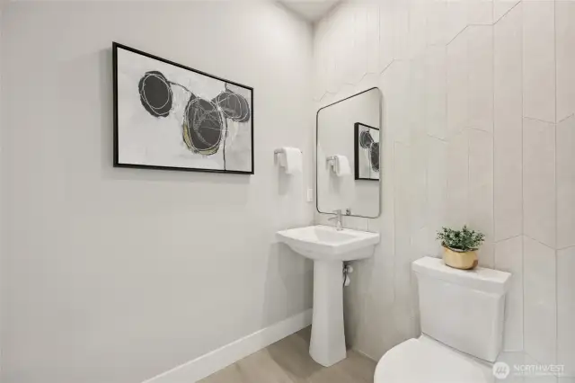 Half bathroom off entry. Photos are for representational purposes only.  Colors and options may vary.