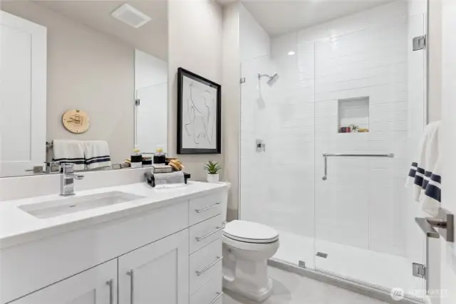 Lower floor bathroom has a beautiful shower. Photos are for representational purposes only.  Colors and options may vary.