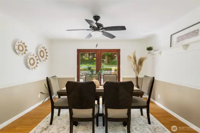 Transition through French doors from the formal dining to a private, fully fenced, backyard w/expansive entertainment patio