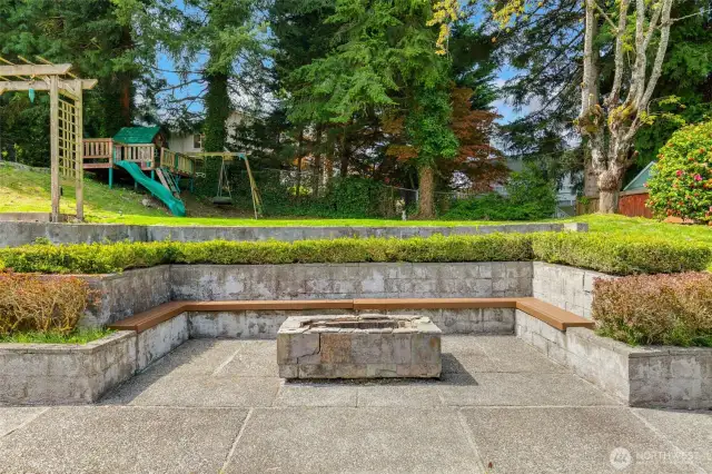 Large patio with built-in benches & firepit