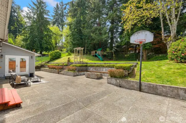 Backyard has patio, play set, BB hoop, and shed.