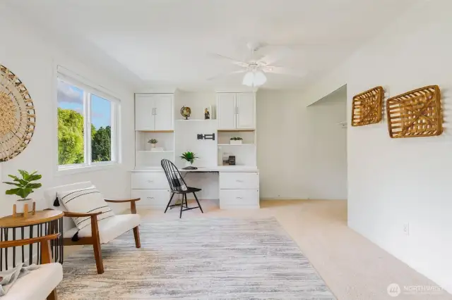 Large bedroom at the front of the house with built-in desk.