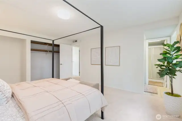 Primary bedroom features a wall of closets.