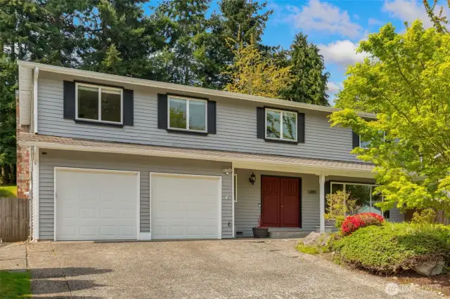 Covered enterance, large 2 car attached garage includes storage & work bench, RV pad, and ample off street parking.