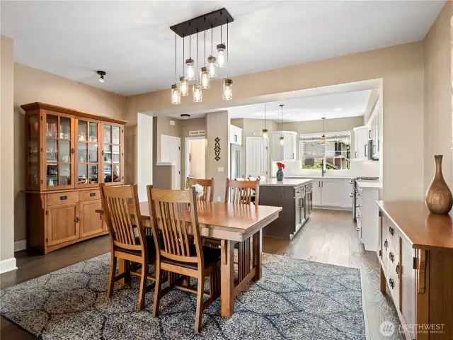 This open layout effortlessly flows into the modern kitchen, ideal for daily living and social events.