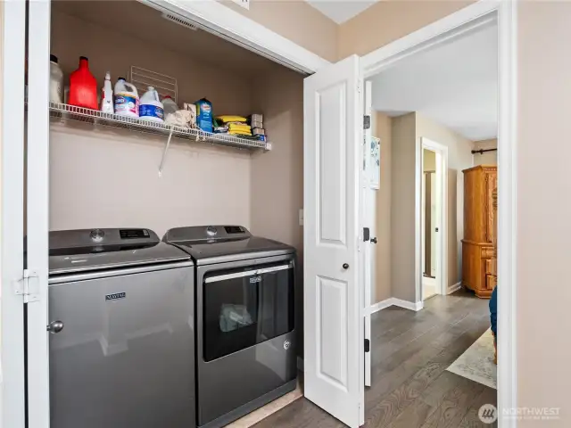 Laundry day is a breeze with the included, high-efficiency washer and dryer, neatly tucked away in a dedicated closet with storage.