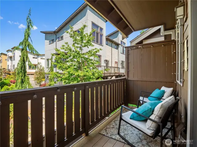 Step outside and enjoy your private balcony, offering a pleasant outdoor retreat and views of the surrounding community.