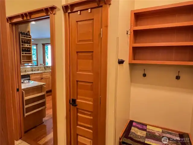 Utility area on the left of the doorway, behind me is the studio and garage access to the right.