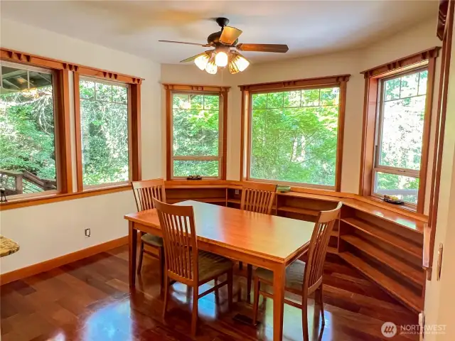 Wood wrapped windows in the dining area and built in cabinets