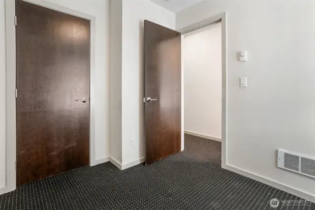 Bedroom #1 showing closet & door to hallway.
