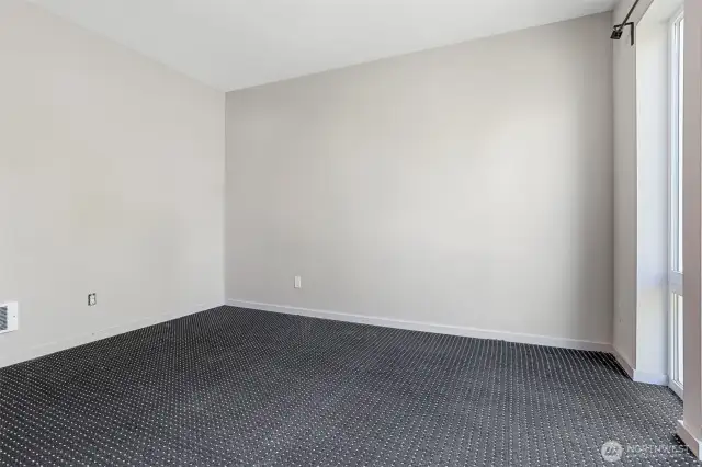 Primary bedroom from closet door.