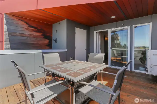 Partilly covered roof top patio plumbed with natural gas and extra storage.
