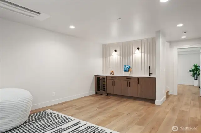 Detailed wall with bar and beverage cooler!