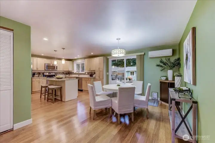Kitchen and dining area are adjacent to your living room space. Stackable Washer and dryer (washer and dryer do not convey with sale) area to the left in closet. Granite counters plenty of storage and easy access to your outdoor deck and yard.