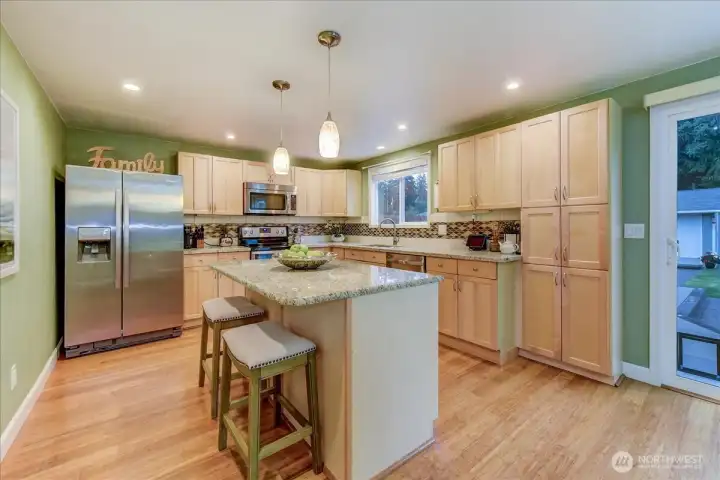 Closer look at kitchen...access to back yard from the sliding door on right.