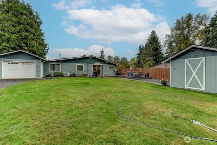 Great pic of the back yard and as you can see there is a garage door that accesses the large 50'x12' garage...