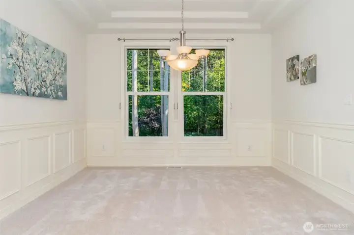 The formal dining room faces the greenbelt view!