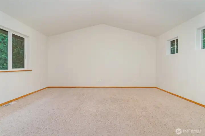 Upstairs Bonus room with a vaulted ceiling & ample space for the pool table.