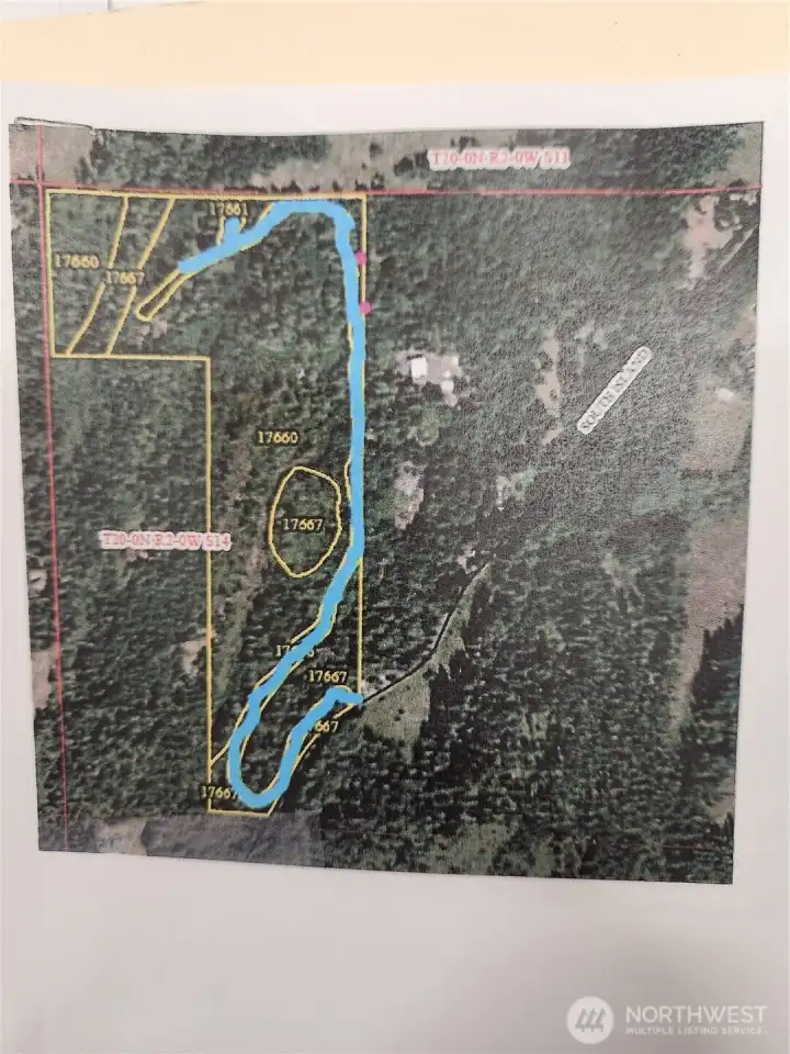 This shows the approximate location of the driveway. The house is at the upper left where the blue line stops.  The two pink dots are the approximate location of power vaults that could serve the property.