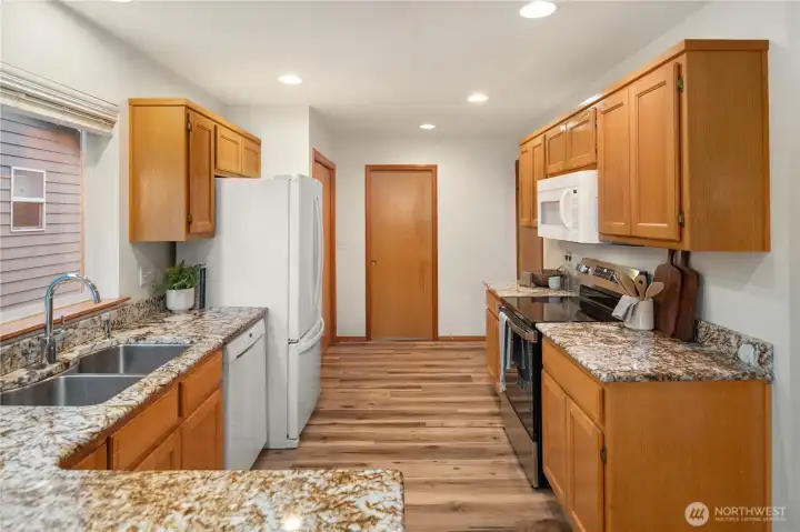 Kitchen looking towards back entry/laundry room.