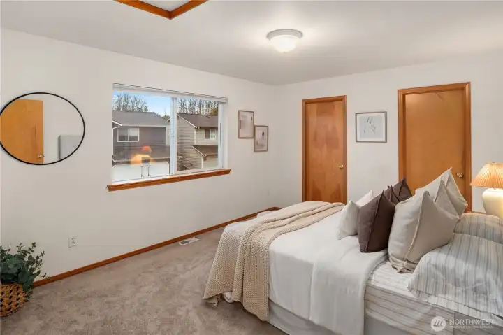 Primary bedroom. Peak-a-boo mountain views from window.