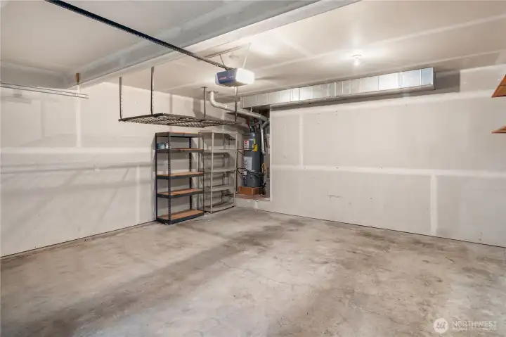 2-Car garage with storage racks.