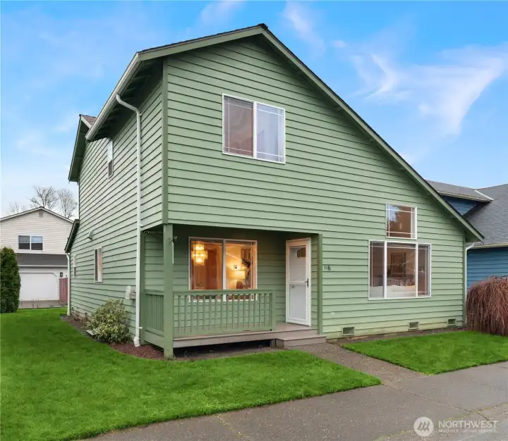 Covered porch found at front of home.
