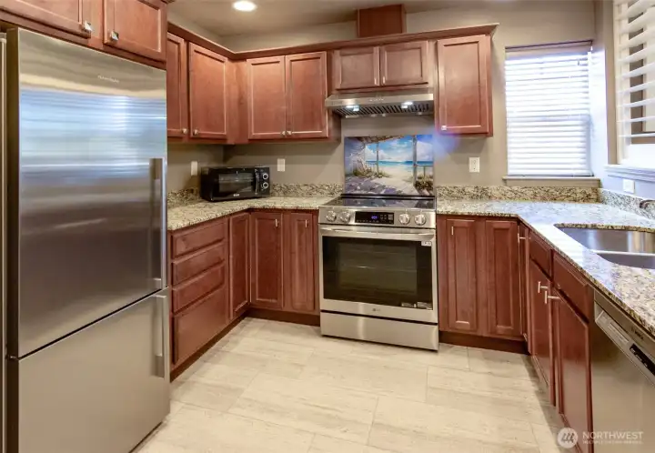 The spacious kitchen has lots of counter space and newer appliances.