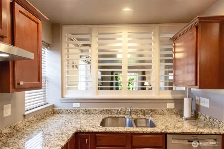 Custom shutters allow you to see into the living and dining area.