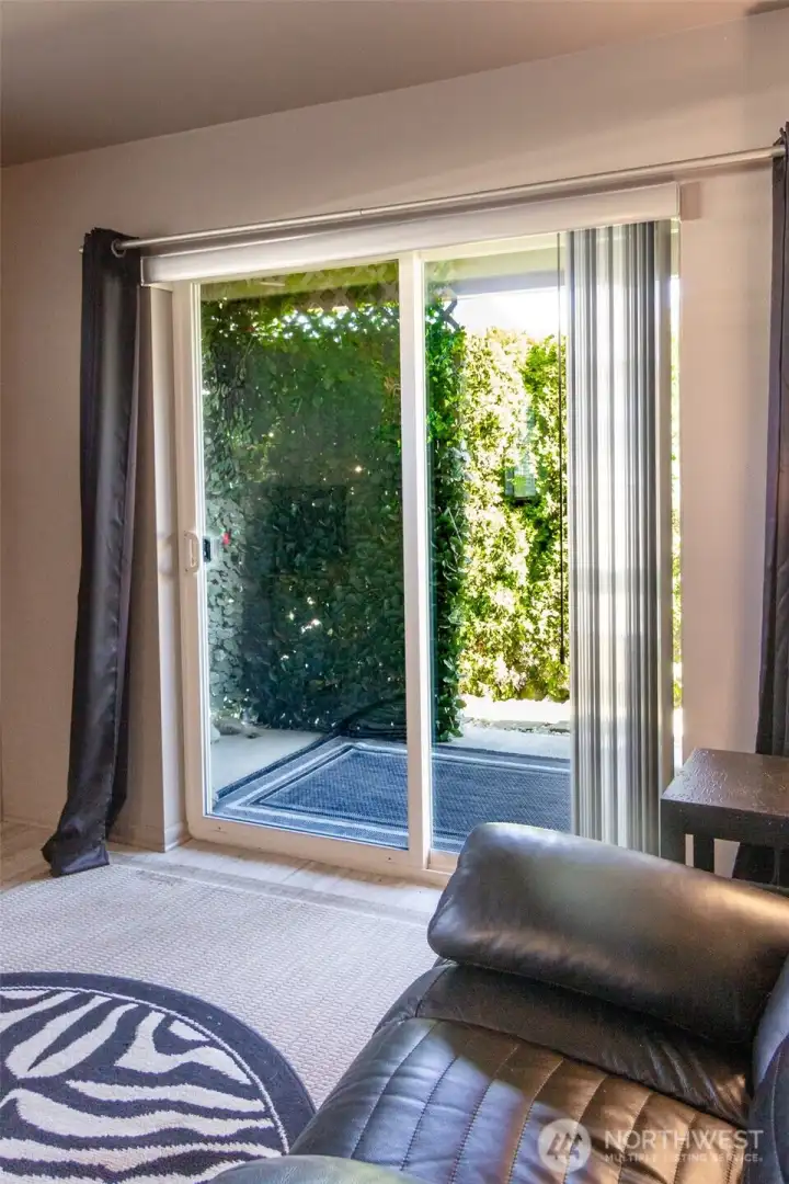 The living room opens up to your own private patio!