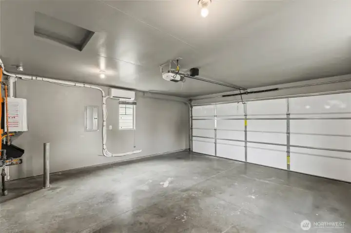 The walls are finished and the heat pump provides year round comfort in the garage. Easy to create a workshop area or have an area for ping pong! The walls are finished and the heat pump provides year round comfort in the garage. Easy to create a workshop area or have an area for ping pong!