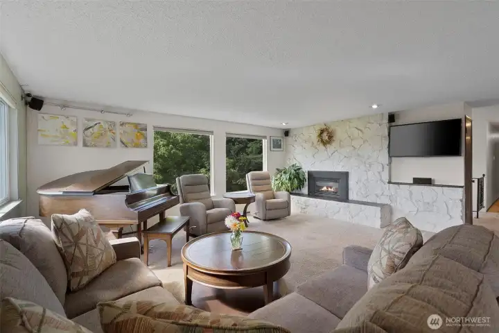 Inside, the home is an inviting mix of classic features and pleasant updates. Original fireplace has been converted to gas, huge windows bring in abundant natural light and gorgeous pastoral views.