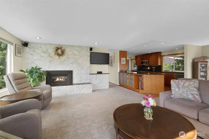 Desirable open floor plan shares light and views throughout living room, dining and kitchen.