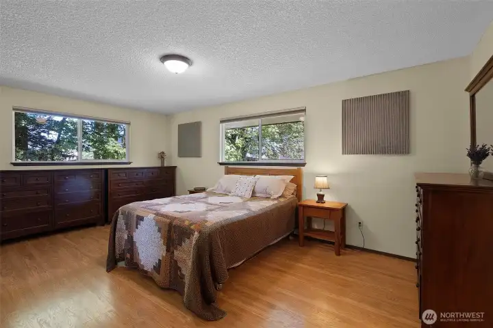 Pretty, peaceful primary suite has luxuriously cozy heated floors!