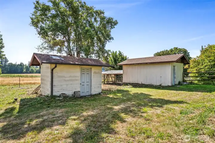 In front is the well house, the building behind is currently used for storage.