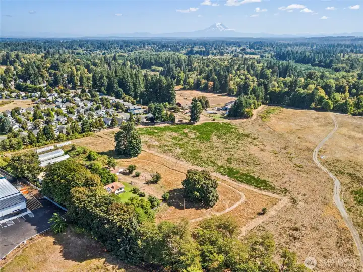 Aerial view of this special property. With no neighbors to the south, and light-ind warehouses to the north (that are typically active only during M-F business hours) this property is a great balance of close-in convenience and quiet country living.