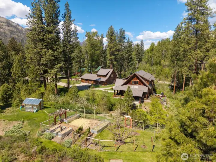 Fenced garden with raised beds—ideal for sustainable living and enjoying a true farm-to-table lifestyle