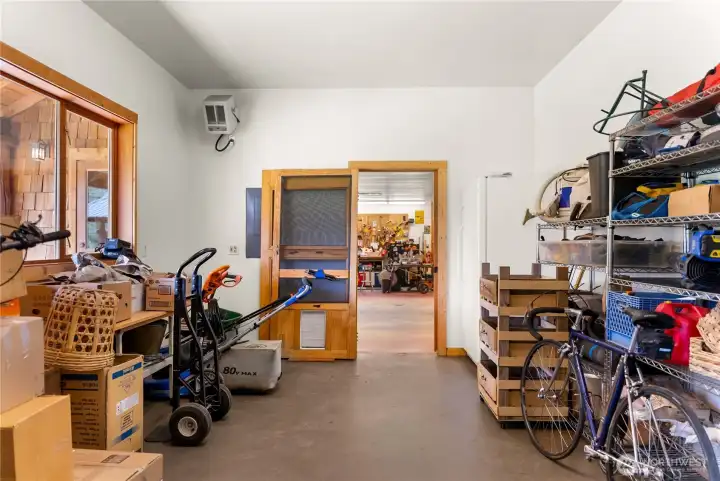 “Methow Gear Room” versatile space designed as a catch-all for year-round living—ideal for gear storage, exercise area, or home office, with easy access and flexible functionality