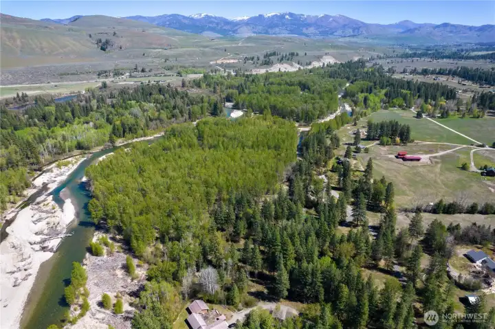 Private community Methow River frontage with abundant wildlife sightings and a rich variety of birds, paired with easy access to the community trail system—offering an exceptional blend of nature, recreation, and privacy at 23 Green Road
