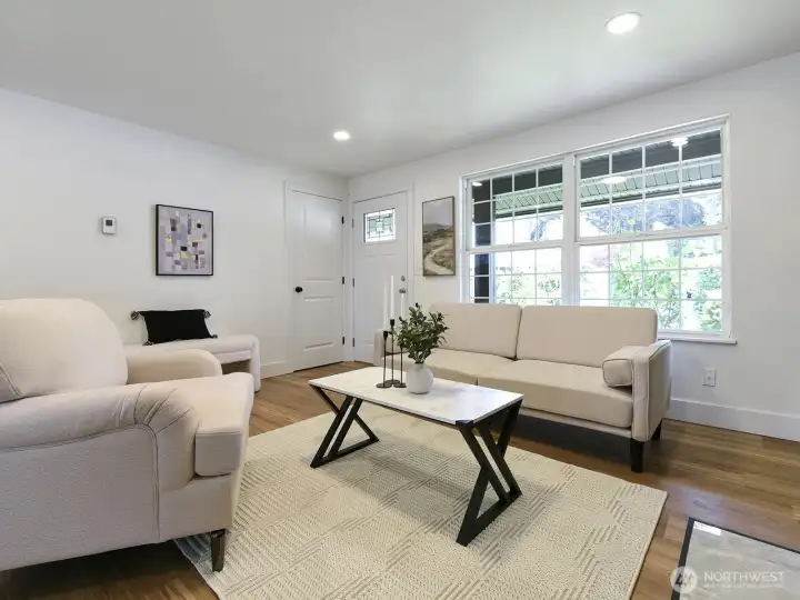 The living area beckoned with its cozy fireplace. The unique mantle, surrounded by custom wood walls... while the flicker of the fire danced shadows across the room, creating an atmosphere of tranquil comfort