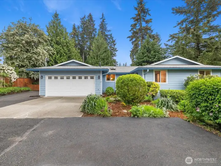 Front of home, RV parking to the left. Two car attached garage, two car parking in front of garage & additional space in front. Lot's of parking options!