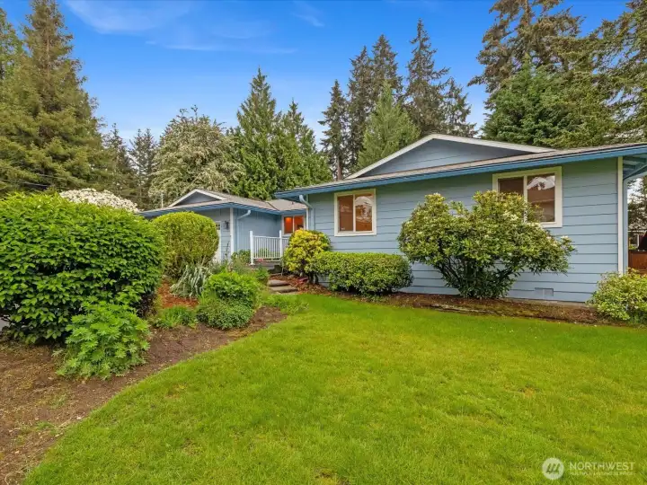 Front of home, very lush private yard!