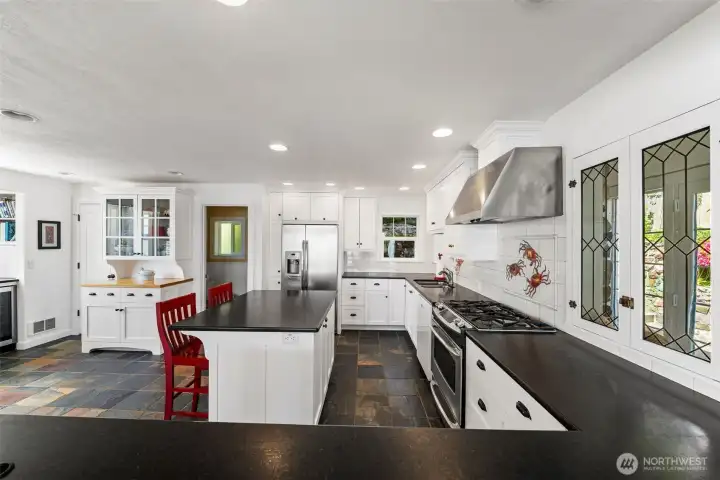 Room for entertaining a crowd! Plenty of cabinet and counter space for cook, prep and storage