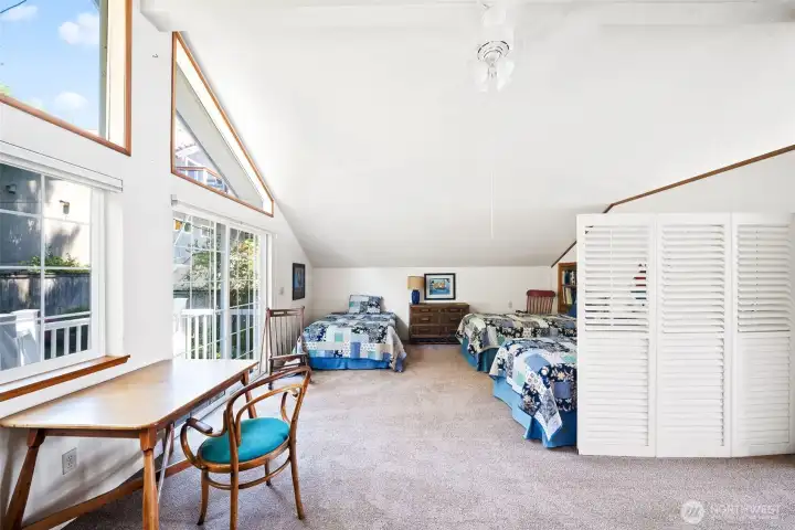 This room upstairs can also be the primary. Or use it as the owners have here....Balcony overlooking the private courtyard at the back of the house.
