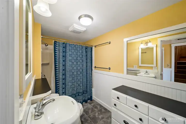Lower level bath is the perfect spot to wash the sand away after a day spent in the sun and surf