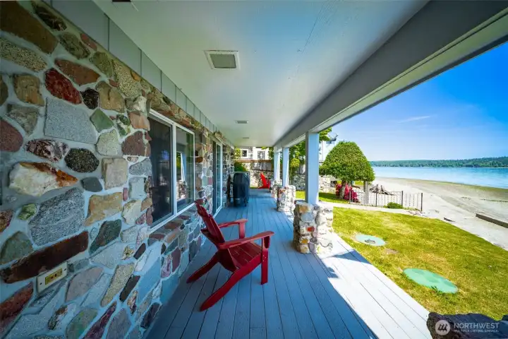 Lower level covered deck is a great spot to BBQ year round, steps from the water