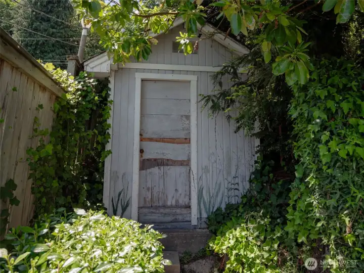 Don't forget to poke around the property to find this charming playhouse. Lots of potential for fun!