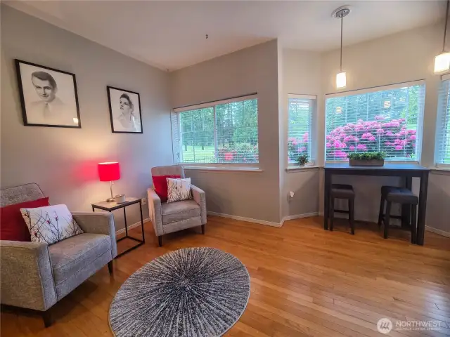 This is a flex space off the kitchen that can be family room space, casual eating space with gorgeous views of the 17th tee of Northshore Golf Course.